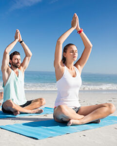 people-doing-yoga-on-the-beach-2023-11-27-05-20-15-utc