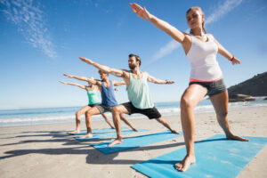 people-doing-yoga-on-the-beach-2023-11-27-05-25-53-utc